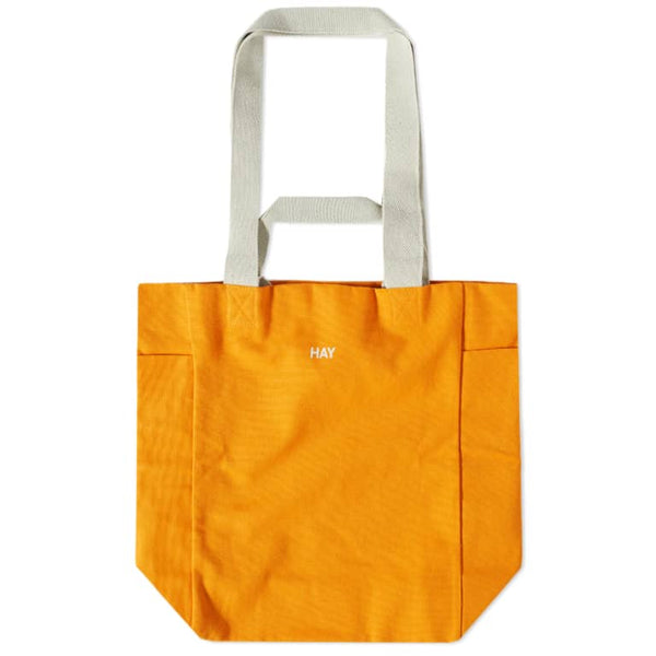 HAY Everyday tote bag. Practical and stylish design with ample space for daily essentials. Features sturdy handles and a versatile look, perfect for carrying items to work, the gym, or running errands.