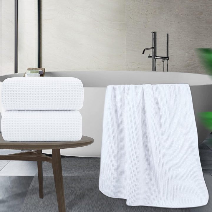 DWR Waffle Towel in White, featuring a textured waffle weave design. This towel offers a sophisticated look with excellent absorbency and a soft, breathable feel, perfect for adding a touch of elegance to your bathroom