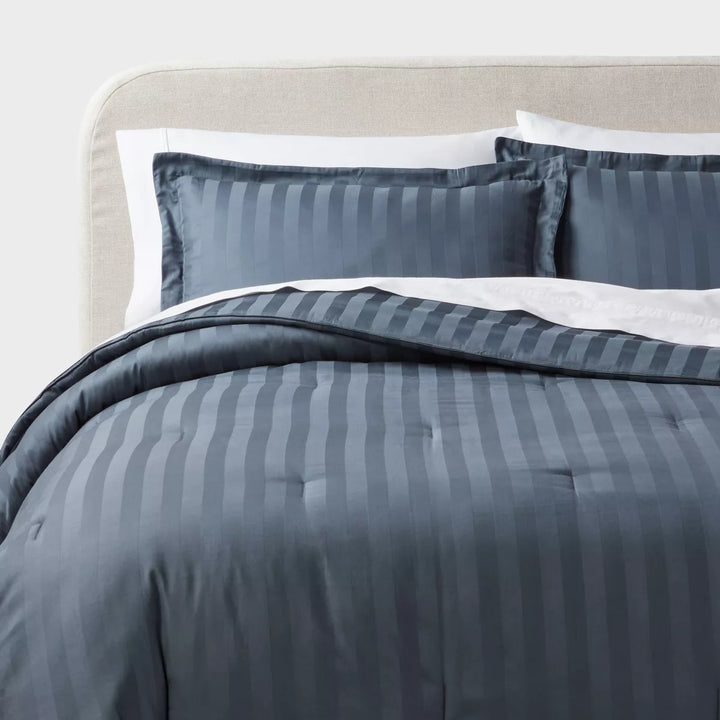 3-piece full/queen comforter and sham set in tonal stripe, navy voyage, from Hearth & Hand™ with Magnolia. Features a sophisticated tonal stripe pattern in navy. Please note, sets may be missing pieces or otherwise incomplete.