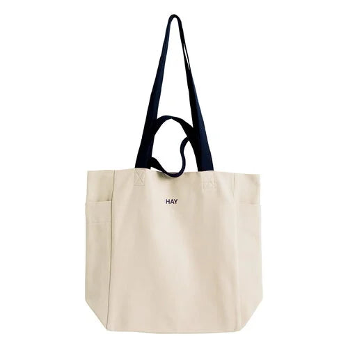 HAY Everyday tote bag. Practical and stylish design with ample space for daily essentials. Features sturdy handles and a versatile look, perfect for carrying items to work, the gym, or running errands.