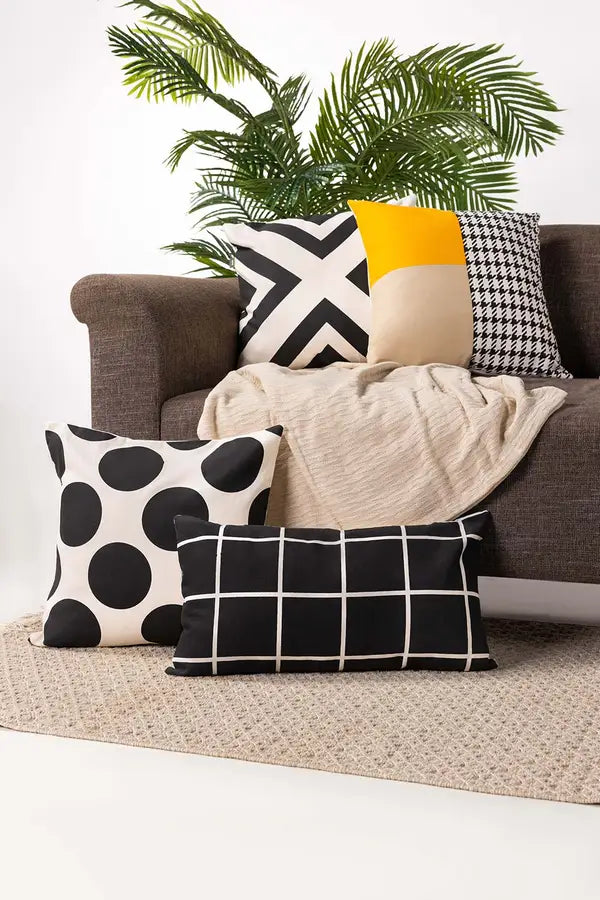 Argo pillow in onyx. Features a sleek and modern design with a deep, rich black color. Made from high-quality materials for a stylish and comfortable addition to sofas, chairs, or beds.