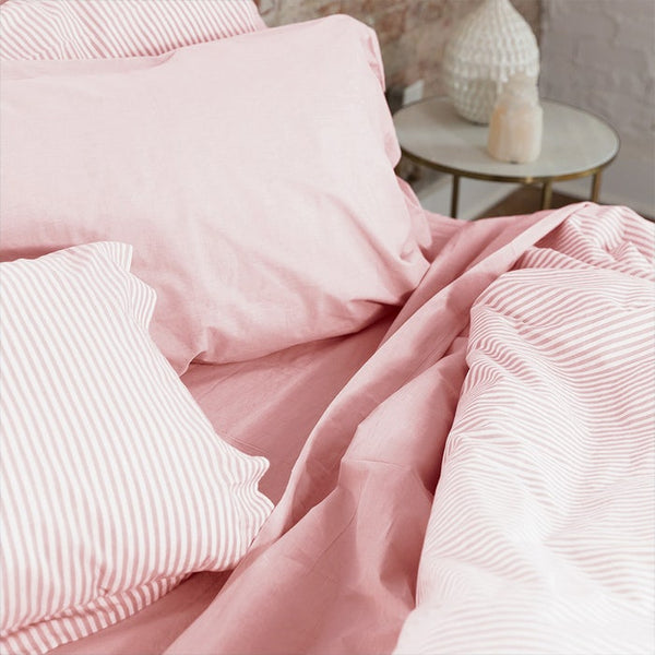 DWR percale sheet set in blush, California king size. Crisp and breathable fabric offering comfort and durability, with a soft blush hue to add a subtle touch of color to your bedroom decor.